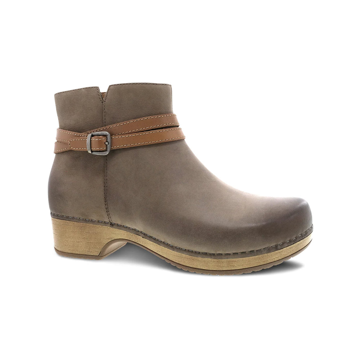 A single Dansko Brook Taupe Burnished ankle bootie with a buckled strap and wooden block heel, isolated on a white background.