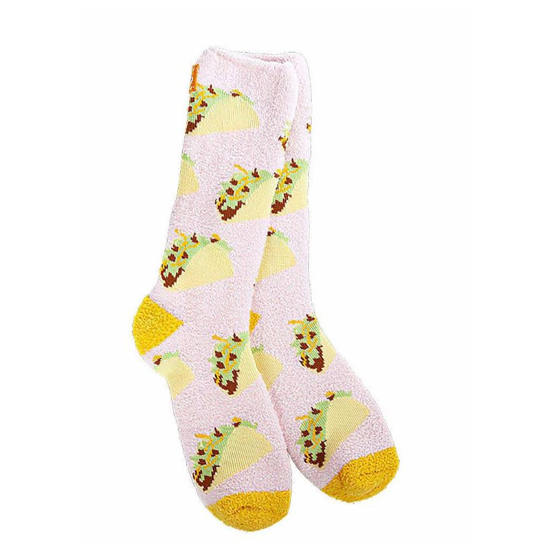 A pair of Worlds Softest Cozy Crew Socks Tacos with yellow toe tips and multiple green turtle patterns, offering ultimate comfort.