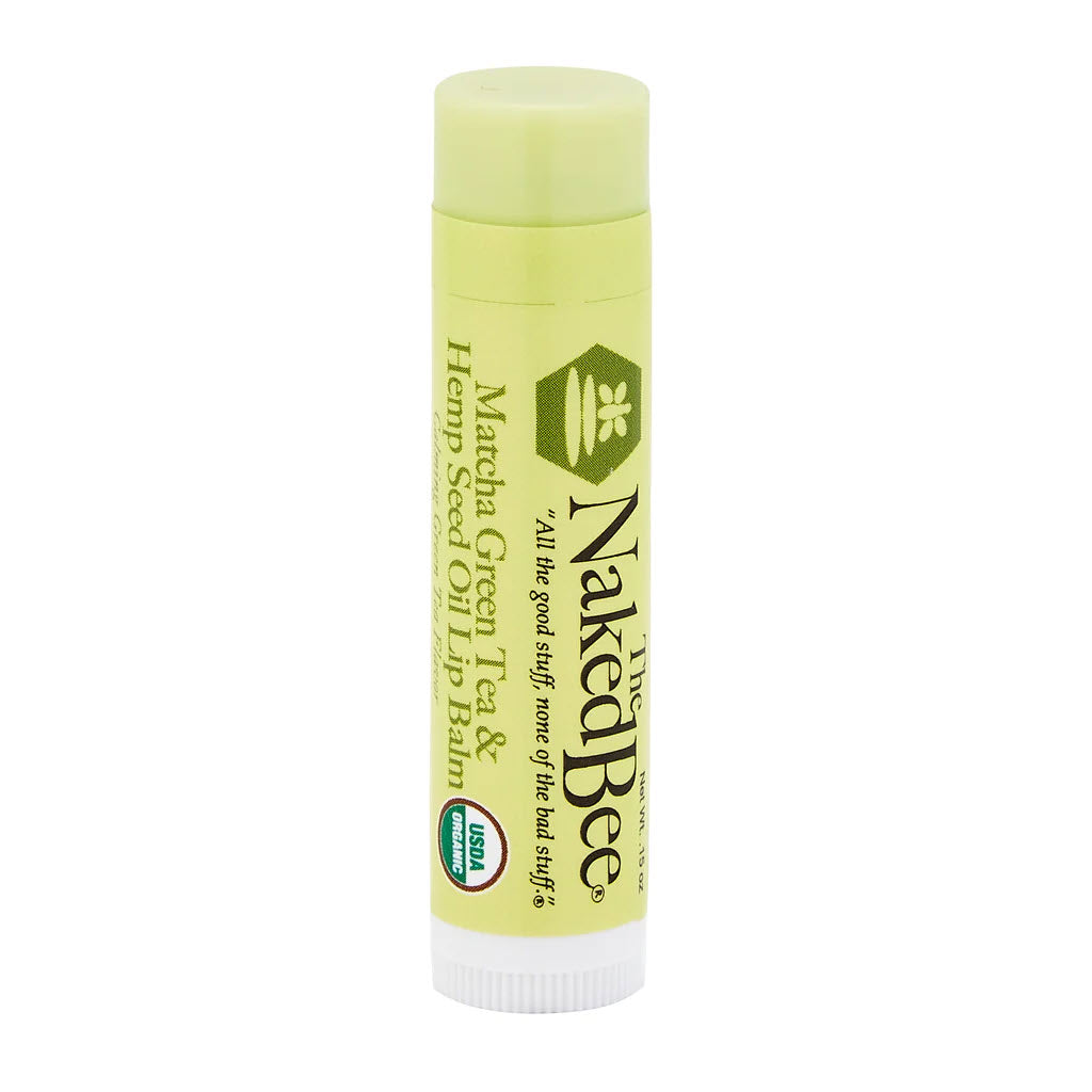 A tube of Naked Bee brand NAKED BEE LIP BALM MATCHA with hemp seed oil and organic beeswax, isolated on a white background.