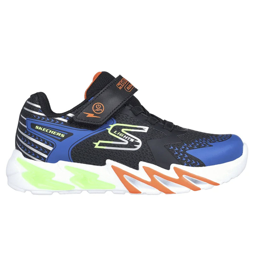 A Skechers Flex-Glow Bolt Black/Blue children's sneaker featuring a blue and black upper with neon green and orange accents, a cushioned comfort insole, and a Velcro strap.