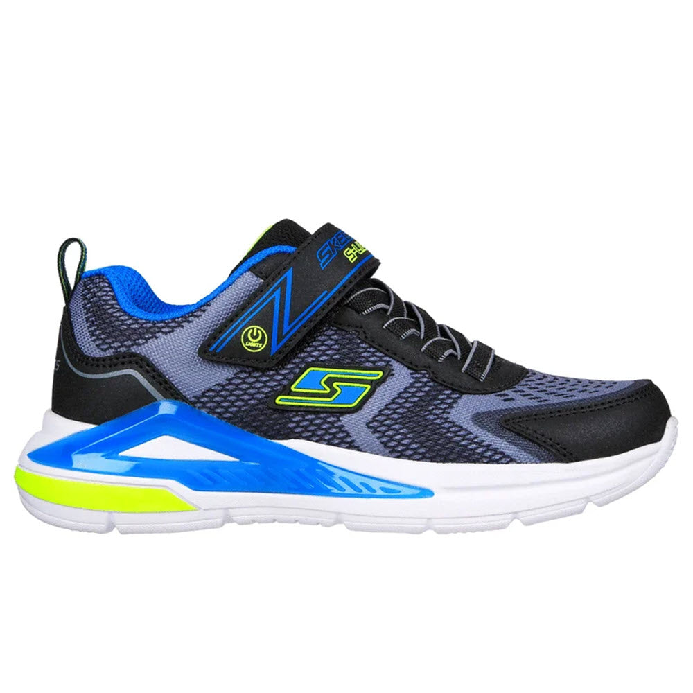 A black and blue Skechers TRI-NAMICS LIGHTS sneaker with a white, light-up midsole and prominent brand logo on the side.