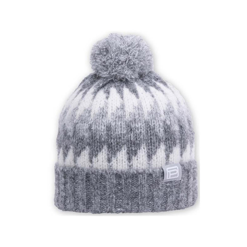 A gray and white knitted Pistil Nikita pom hat with a pom-pom on top, isolated on a white background.