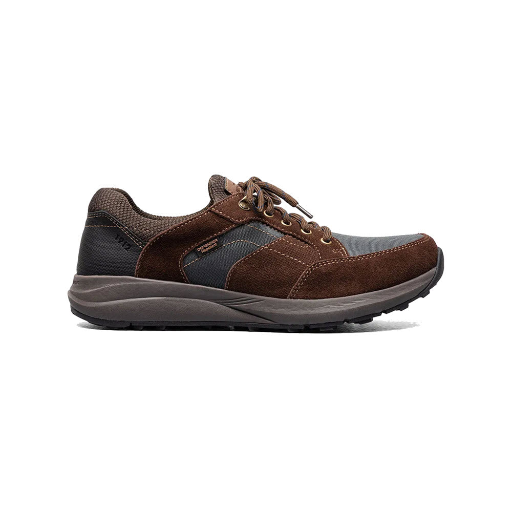A single Nunn Bush Excursion Lite Moc Toe Oxford in brown and gray with laces, featuring a leather and textile upper, and a thick rubber sole with KORE technology.