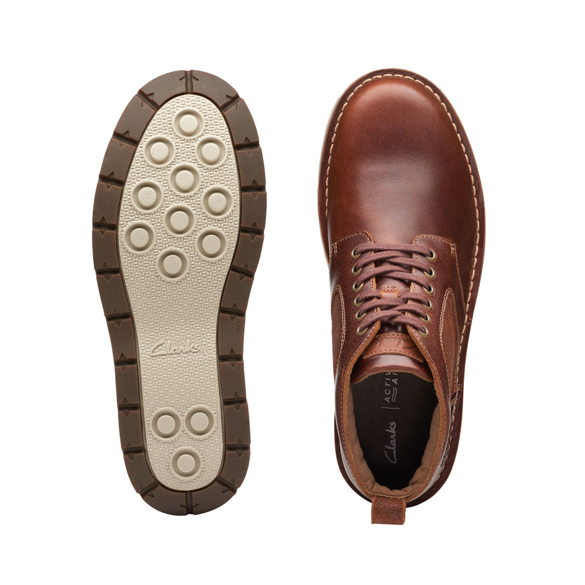 Top view of a brown Clarks Gravelle Top Lace Boot Tan Leather - Mens boot made from premium leathers, next to its sole, showing detailed stitching and embossed branding.