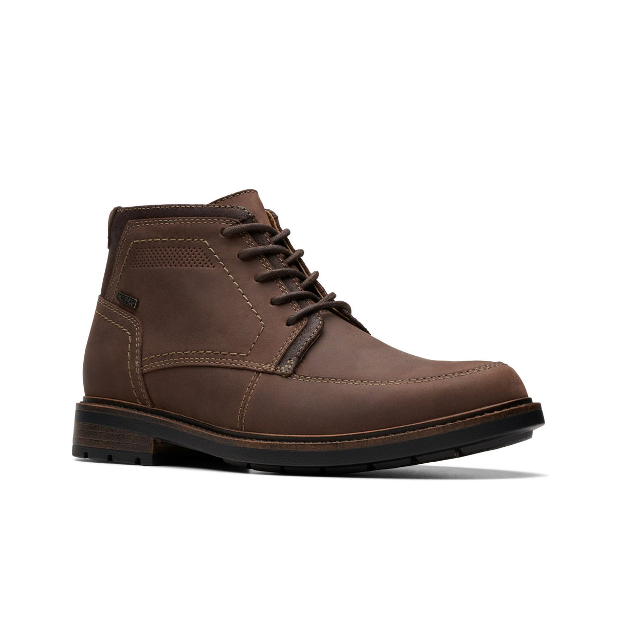 A Clarks Unshire Hi WP Dark Brown Leather boot with a low heel and stitched detailing, featuring Clark&#39;s comfort, isolated on a white background.