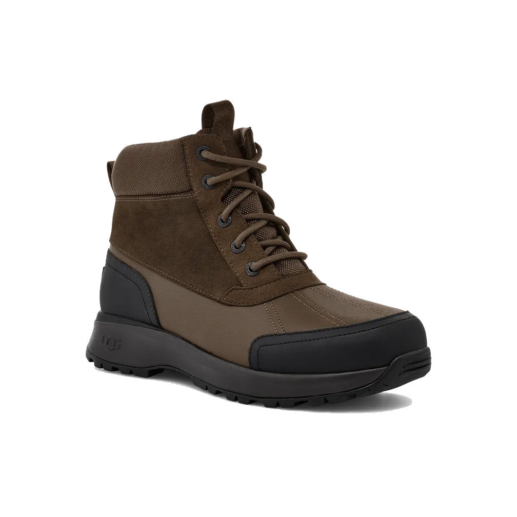 Brown and black men&#39;s high-top UGG Emmett Duck Lace Boot Stout with lace-up front, waterproof leather, and rubber sole, isolated on a white background.