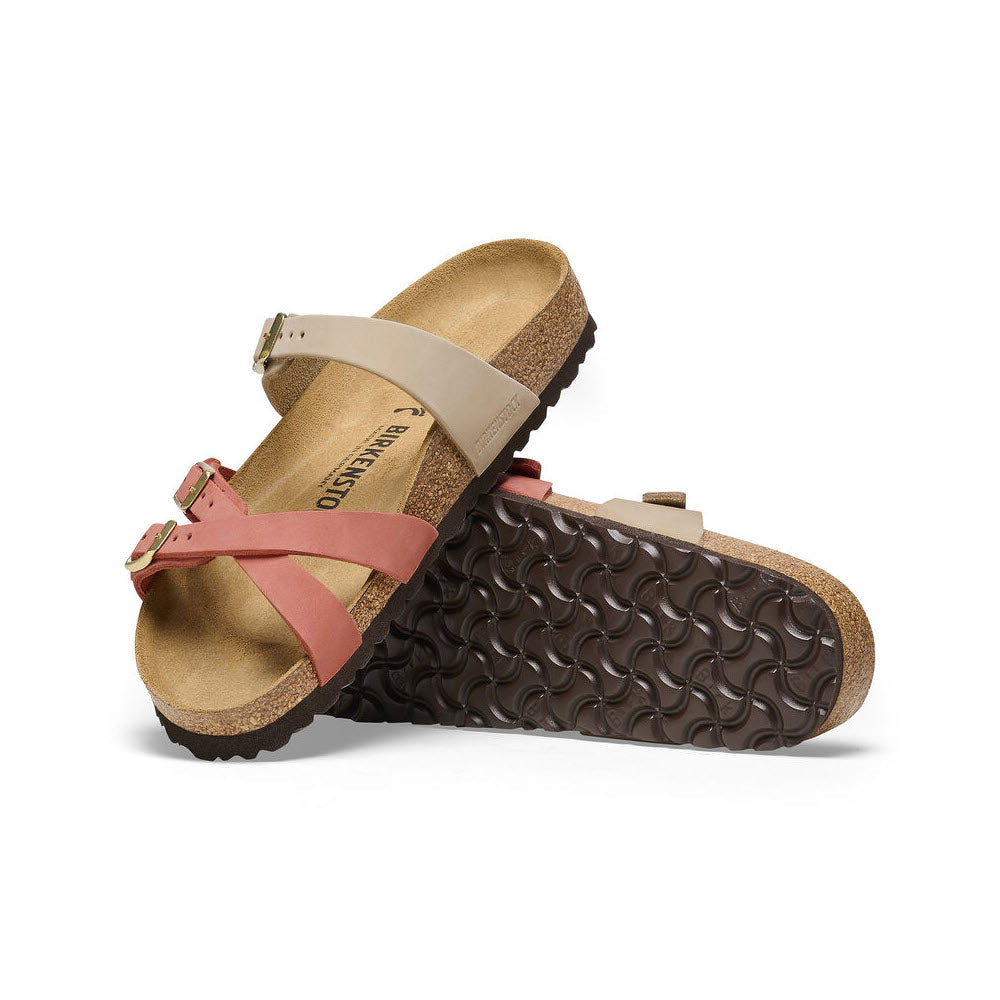 A pair of beige and coral nubuck leather Birkenstock Franca Sandcastle/Mars Red sandals with crisscrossed straps, positioned against a white background.