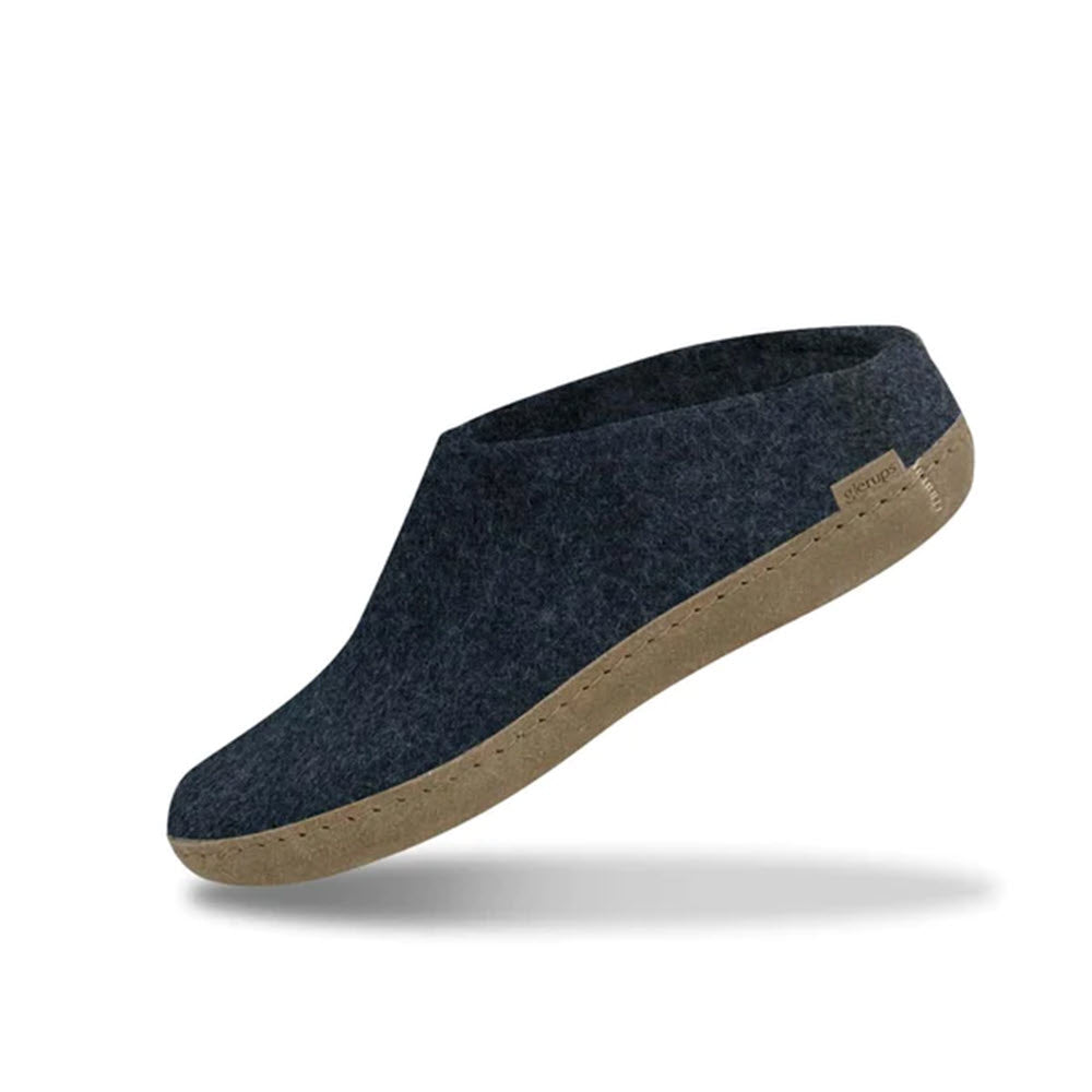 A single Glerups The Slip On Leather Denim slipper in dark blue felt with a tan sole, displayed against a white background, featuring a flexible heel.