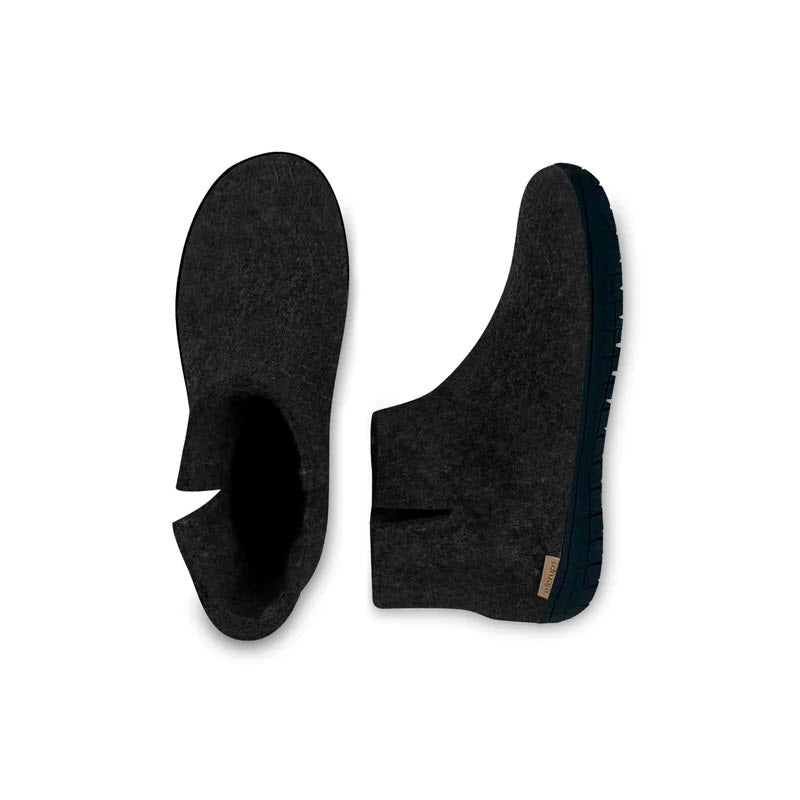 A pair of Glerups The Boot Rubber Charcoal clogs made from natural wool with blue rubber soles, viewed from above on a white background.