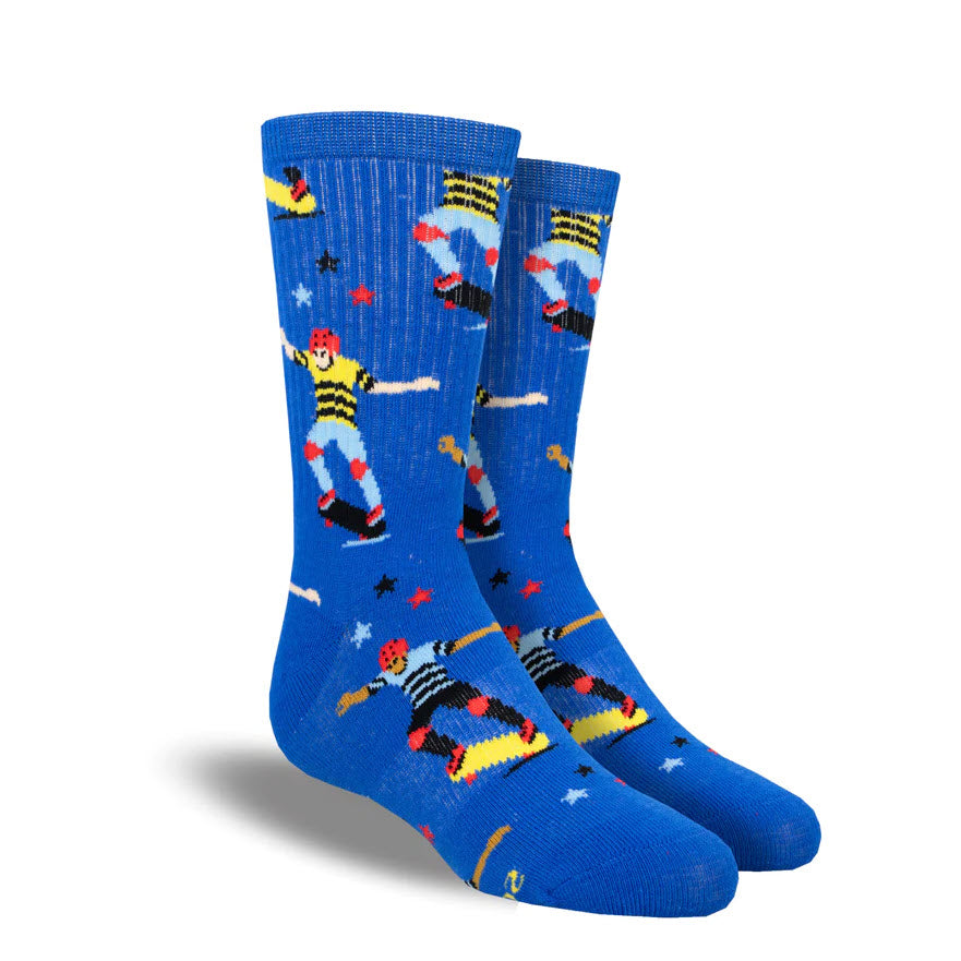 A pair of SOCKSMITH LATER SKATER CREW SOCKS BLUE - KIDS with a whimsical pattern featuring yellow submarines, stars, and waves, isolated on a white background.