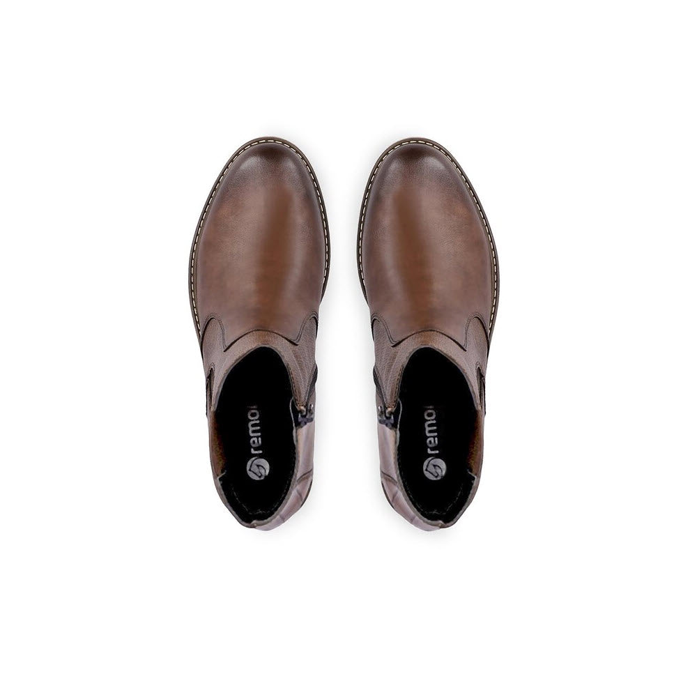 A pair of Remonte Mixed Media Chelsea Bootie Cognac slip-on shoes with a small heel, viewed from above on a white background.