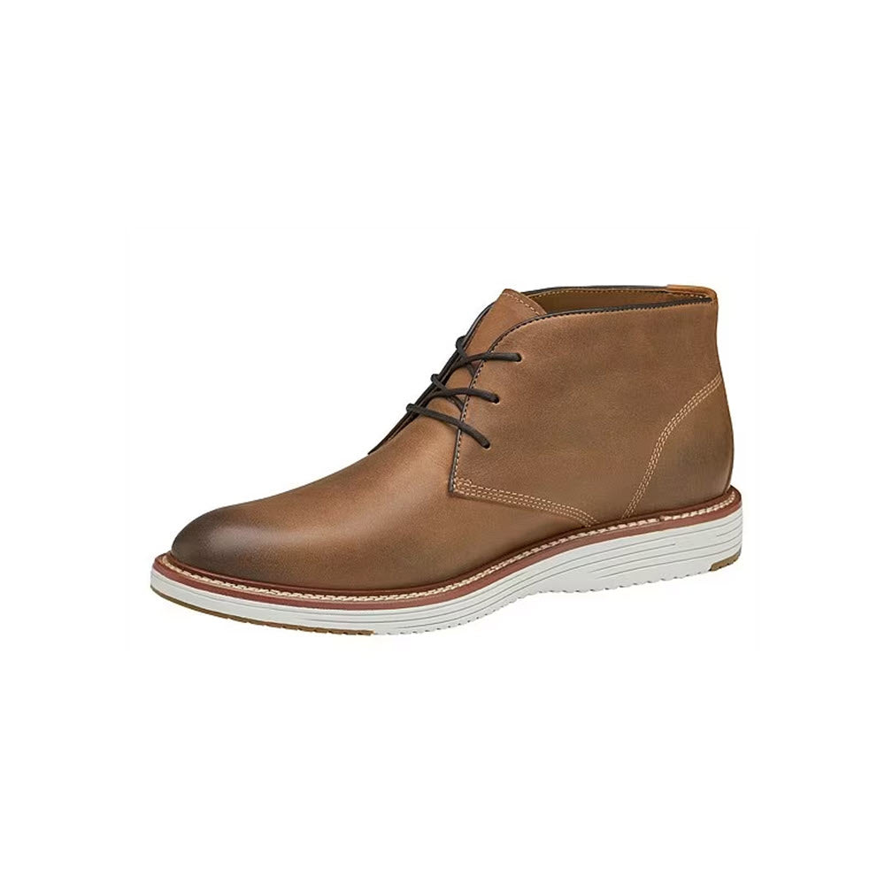 A single brown full-grain leather Johnston &amp; Murphy Upton Chukka boot with laces, featuring a white sole, displayed against a white background.