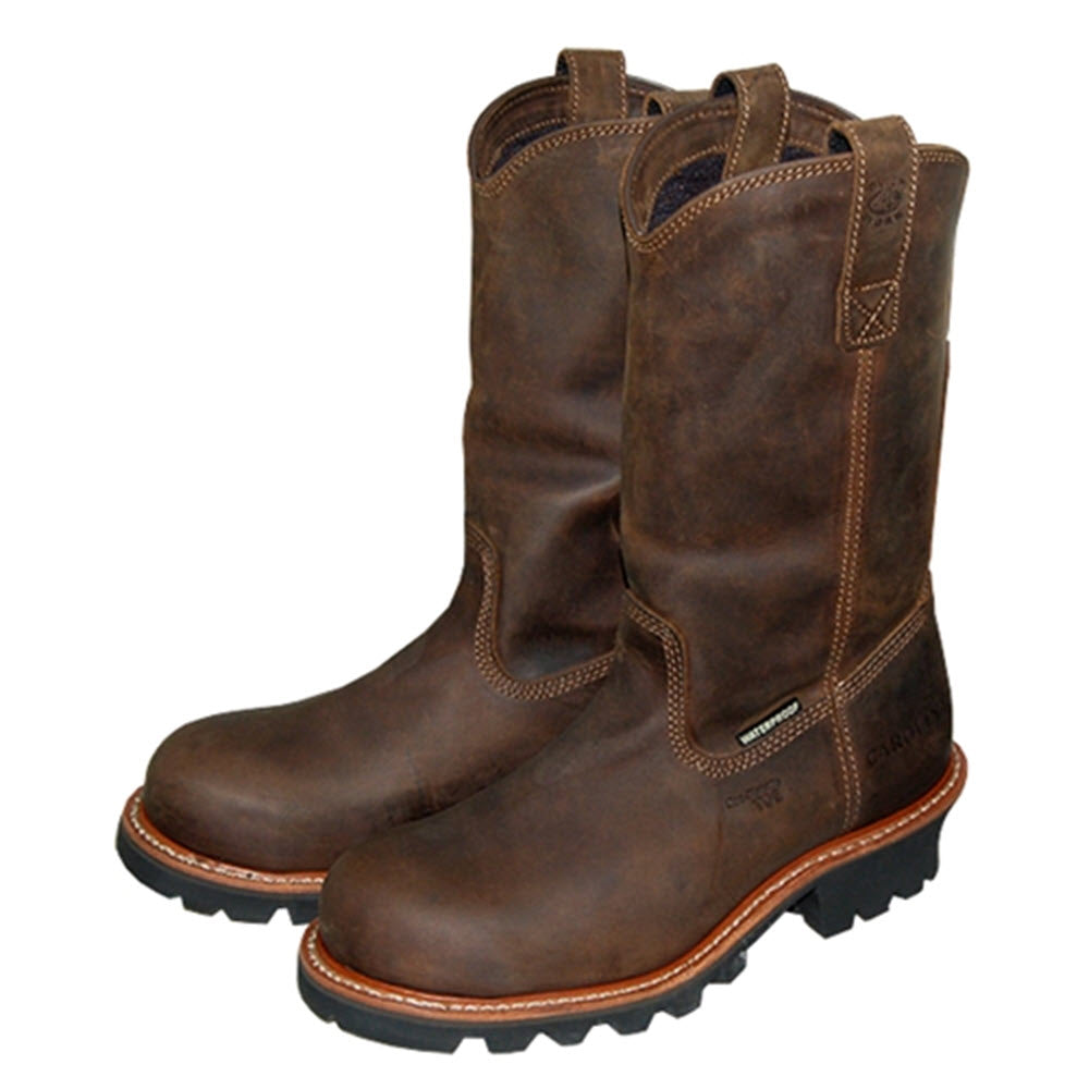 A pair of Carolina Ranch 12 Inch Wellington waterproof composite toe cowboy boots in Crazy Horse Tan leather, with thick, waterproof Scubaliner soles, displayed on a white background.