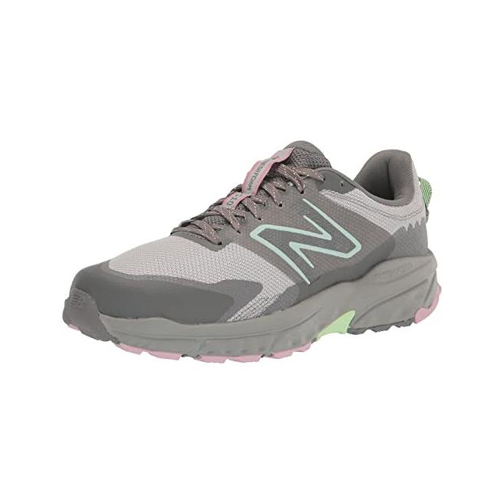 A gray New Balance 510v6 Brighton/Grey trail running shoe with a prominent green &quot;N&quot; logo, featuring pink laces and a green accent on the sole.