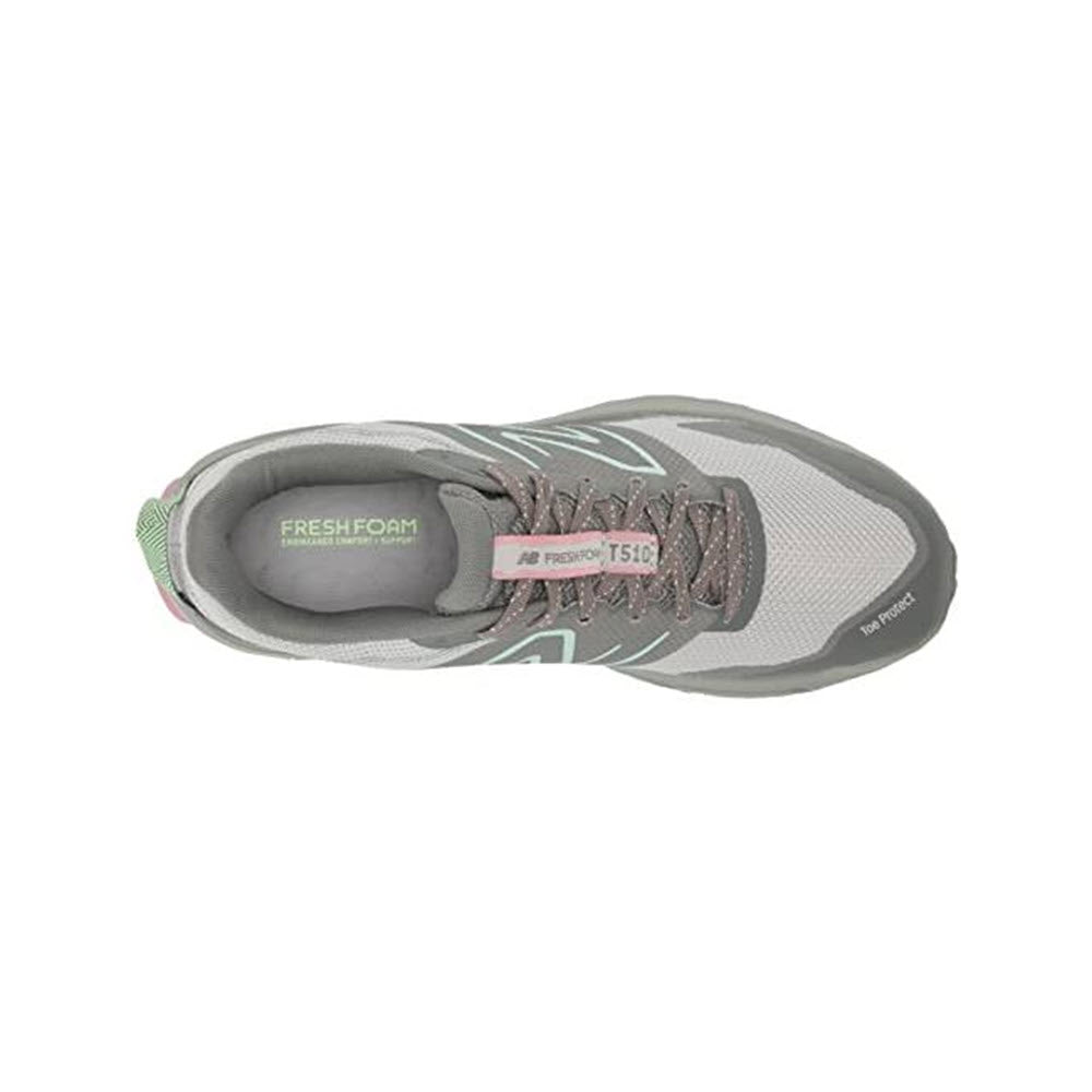 Top view of a gray and pink New Balance 510v6 trail running shoe with &quot;fresh foam&quot; branding on the insole and visible laces.