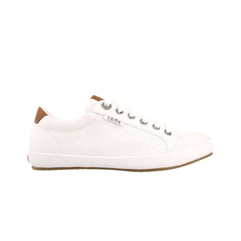 Taos white canvas sneaker with brown leather trim on the heel and white laces, displayed against a white background.