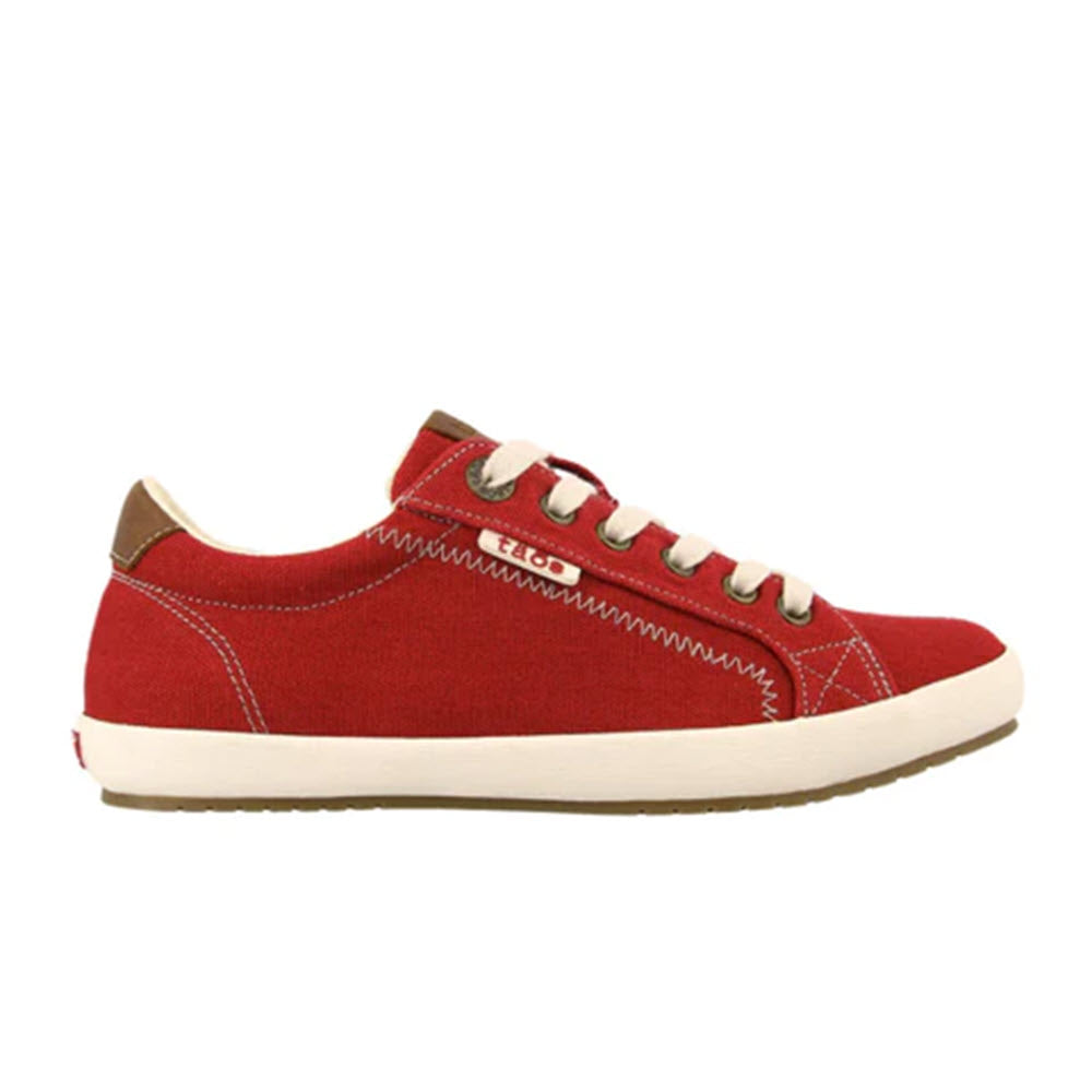 A Taos red sneaker with white lacing and sole, featuring tan detailing on the heel and zigzag stitching on the sides.