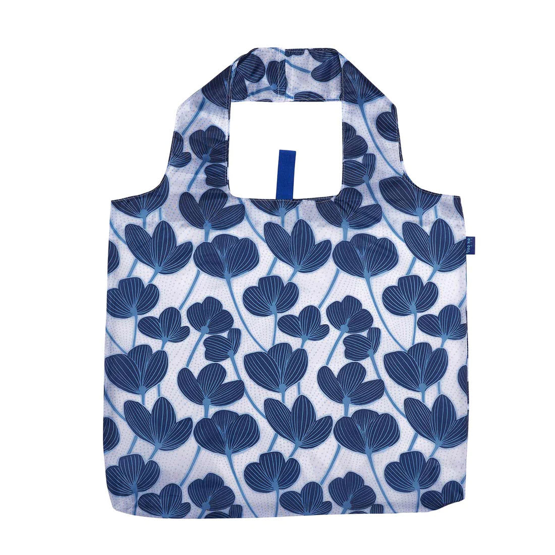 A reusable fabric market shopper bag with a blue and white floral pattern, featuring integrated handles. Try the BLU BAG MODERN POPPY by Rockflowerpaper.