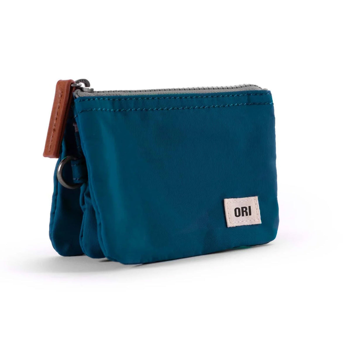 A ORI LONDON CARNABY SMALL POUCH TEAL with a zipper and a brown leather pull tab, featuring a small white label with the text &quot;ori&quot; on the front.