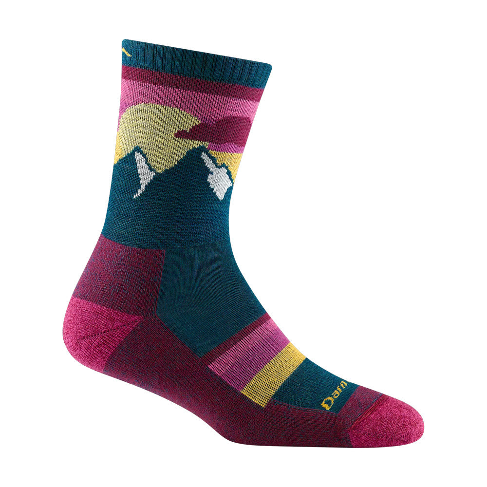 Colorful micro crew hiking sock featuring a mountain design in shades of yellow, pink, and blue with the word &quot;Darn Tough&quot; on the foot.