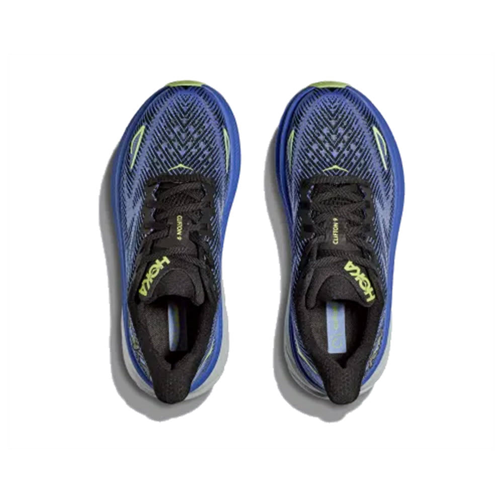 A pair of blue and black Hoka Clifton 9 running shoes with prominent neon accents, viewed from above.