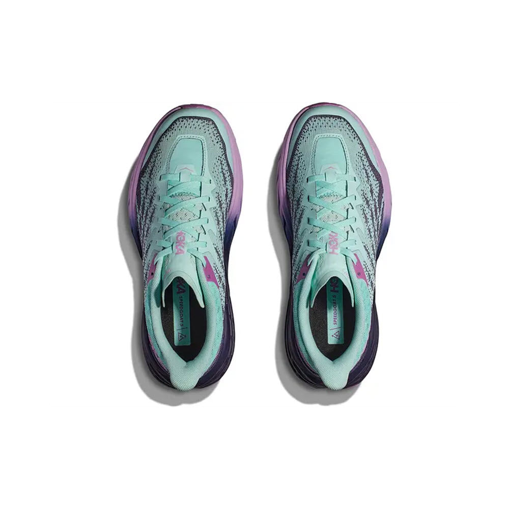 A pair of HOKA SPEEDGOAT 5 SUNLIT OCEAN/NIGHT SKY - WOMENS women&#39;s running shoes with a purple and teal color scheme, viewed from above.