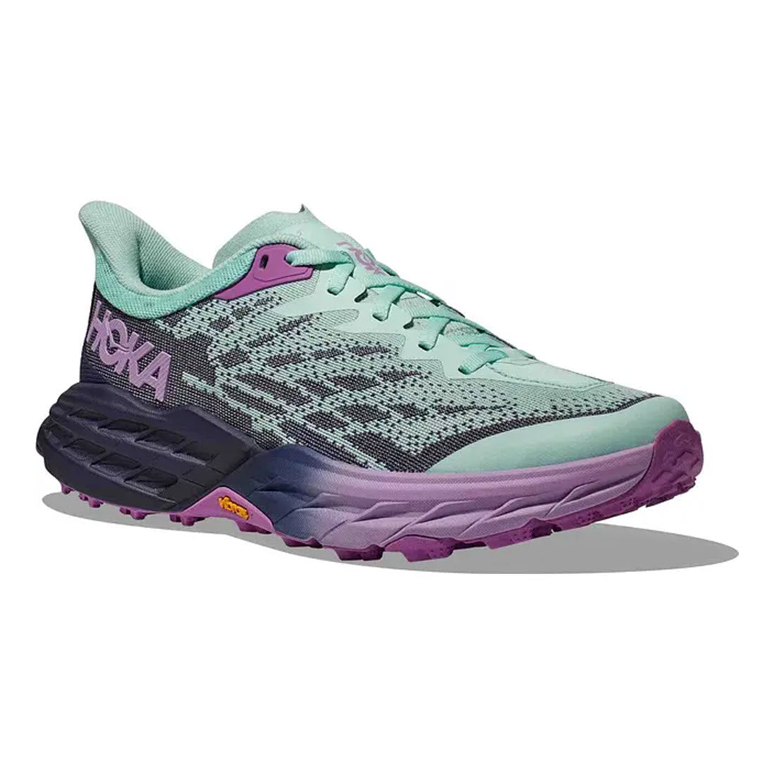 A HOKA Speedgoat 5 Sunlit Ocean/Night Sky running shoe by Hoka with a mint green and purple color scheme, featuring a cushioned sole and breathable mesh upper.