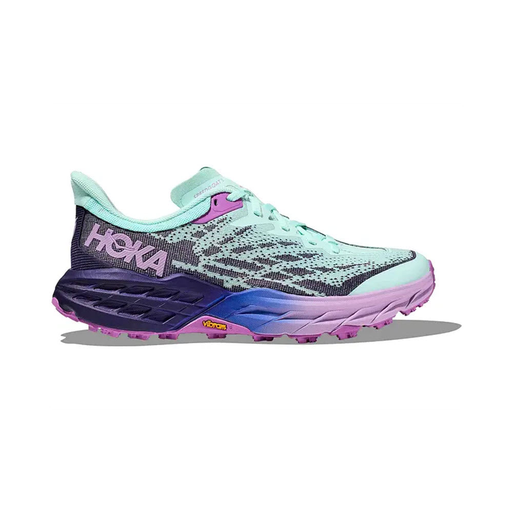 A Hoka Speedgoat 5 Sunlit Ocean/Night Sky trail running shoe featuring a multi-colored design with aqua, purple, and pink accents on a white background.