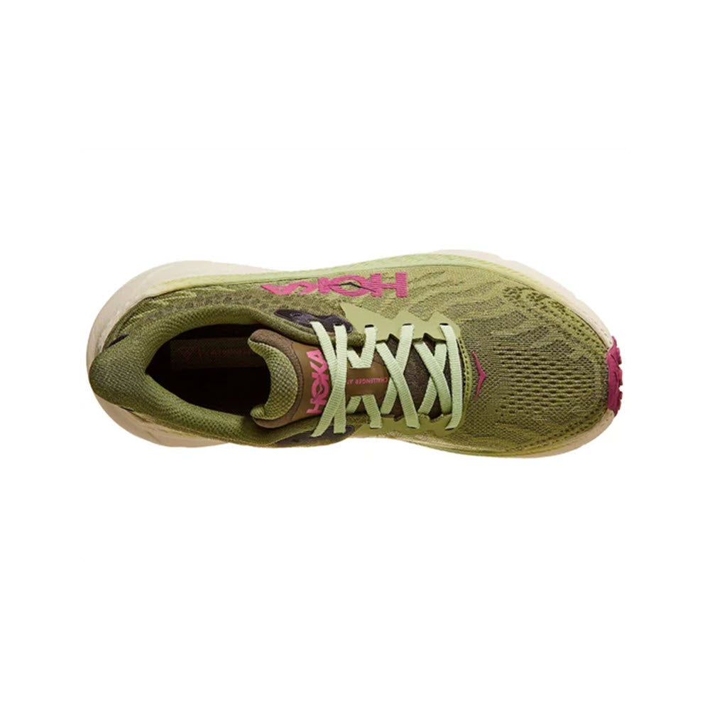 Top view of a green and pink HOKA CHALLENGER ATR 7 FOREST FLOOR/BEET ROOT athletic shoe with laces, isolated on a white background.