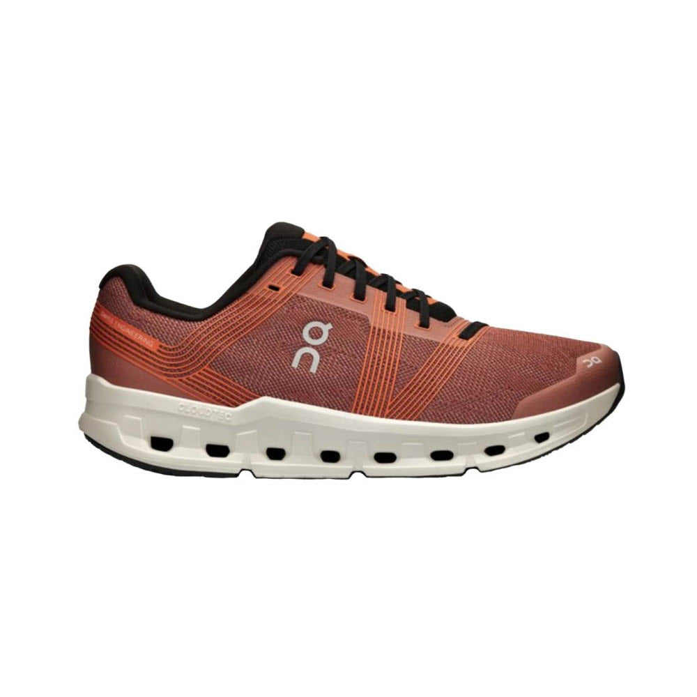 A side view of an On Running Cloudgo Mahogany/Ivory - Womens lightweight running shoe with a white sole, featuring distinct circular ventilation holes and lace-up closure.