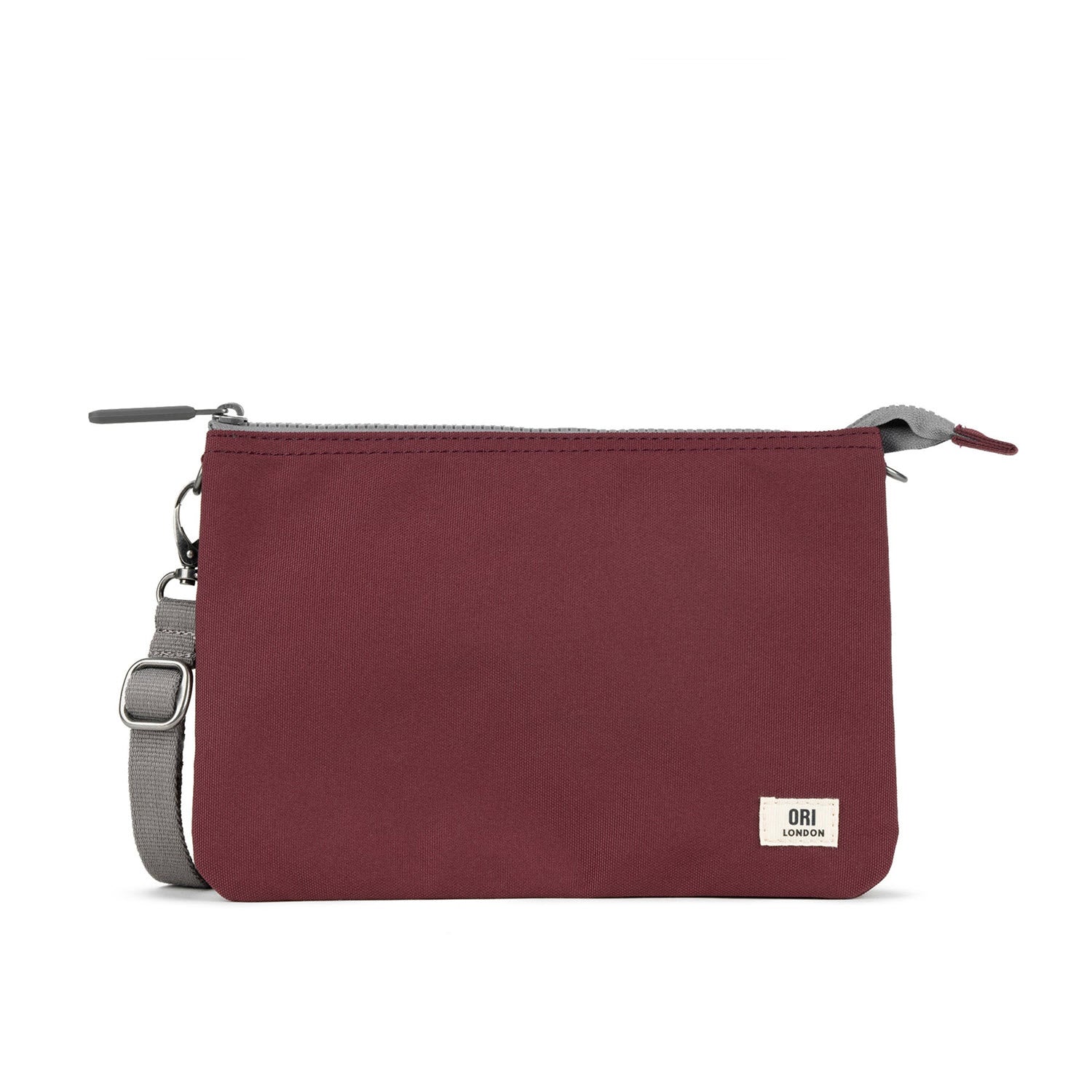 A ORI LONDON CARNABY XL CROSSBODY ZINFANDEL with a zipper, featuring a white logo on the bottom right corner, against a white background.