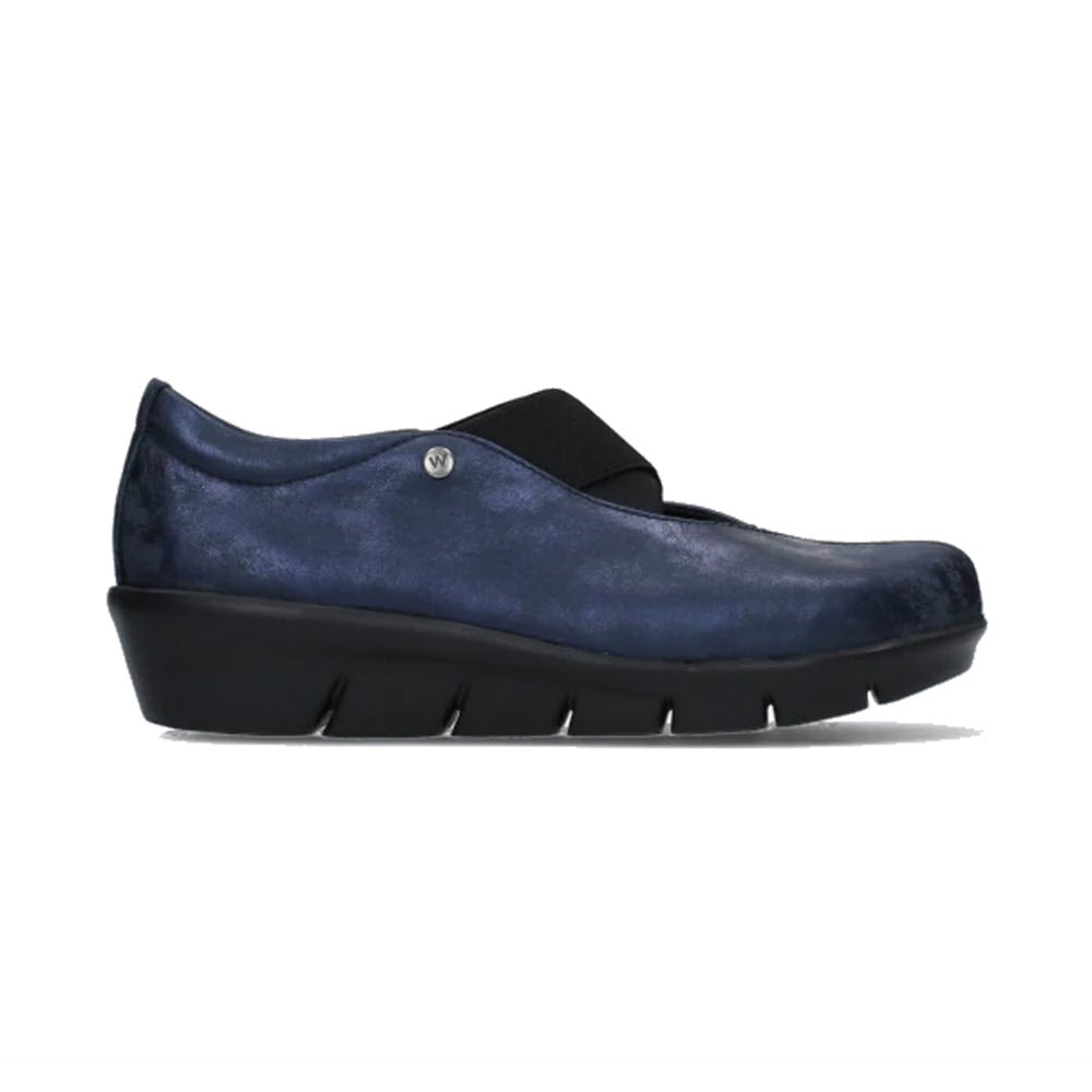 A Wolky navy blue clog with a chunky XL-light sole and a small silver embellishment on the side.