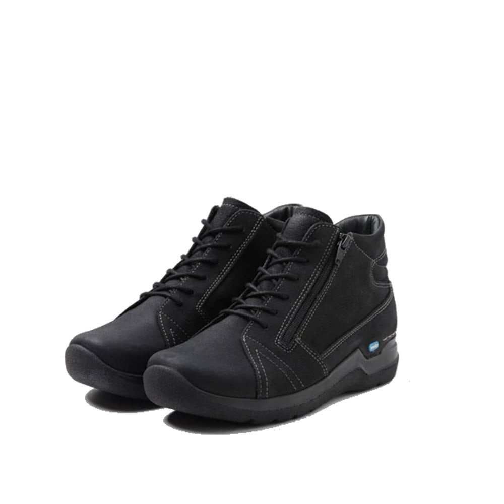 A pair of Wolky WHY Antique Nubuck Black - Womens ankle-high lace-up sneakers with laces, isolated on a white background.