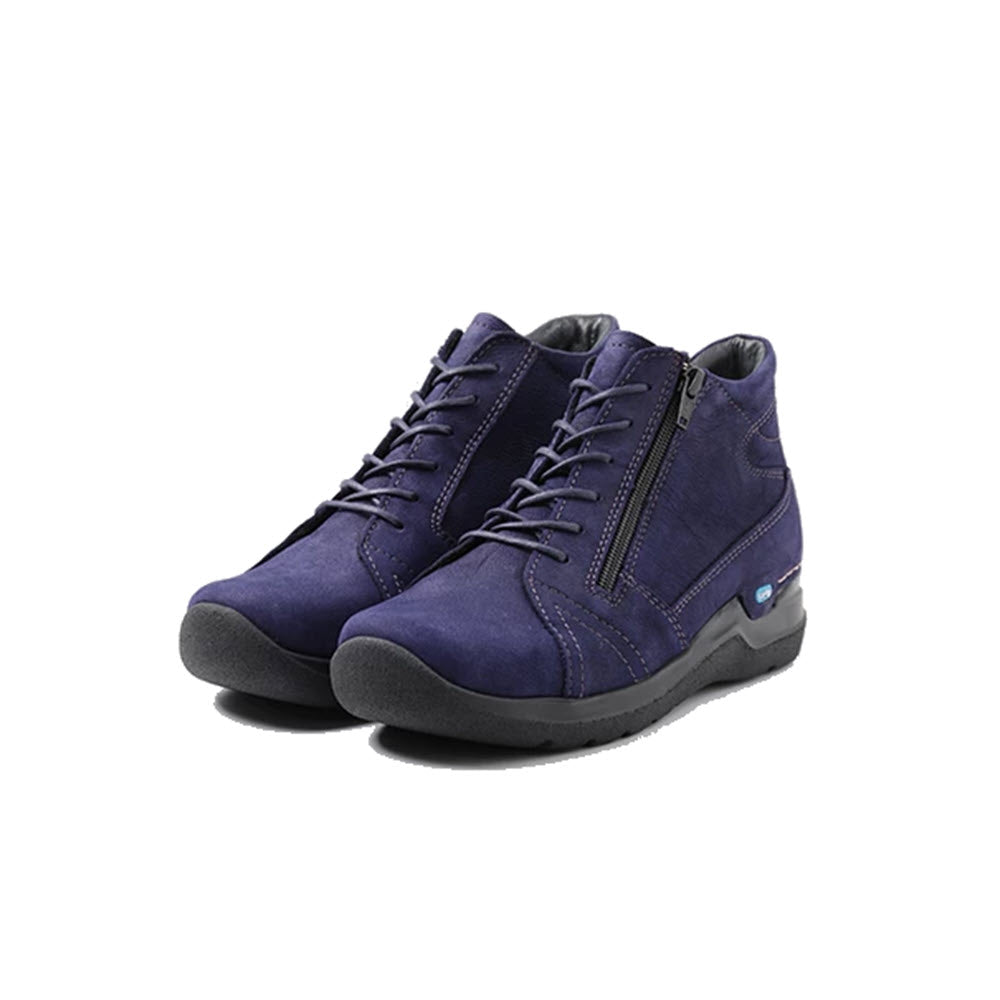 A pair of WOLKY WHY ANTIQUE NUBUCK PURPLE - WOMENS orthopedic high-top sneakers with laces and a small blue label on a lightweight PU sole, displayed on a white background.