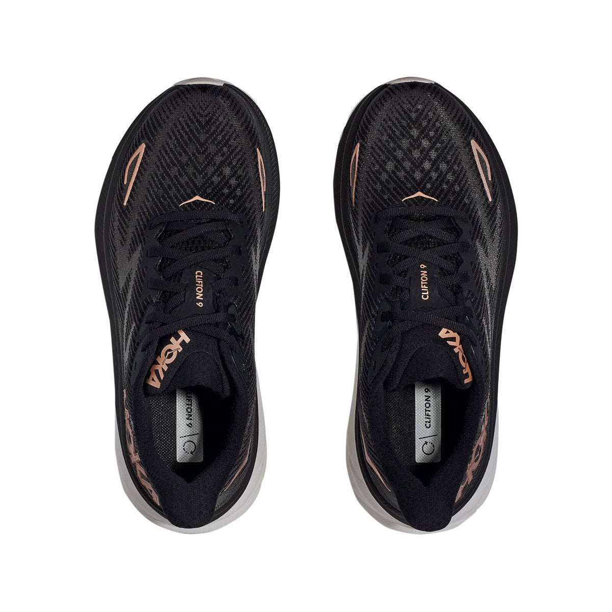 A pair of black HOKA Clifton 9 athletic shoes with rose gold accents and engineered mesh uppers, viewed from above.