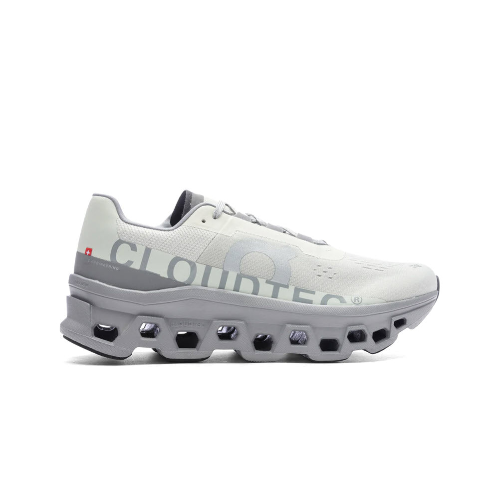 A single ON CLOUDMONSTER ICE/ALLOY - MENS running shoe featuring CloudTec® cushioning for an energizing run, displayed against a white background.